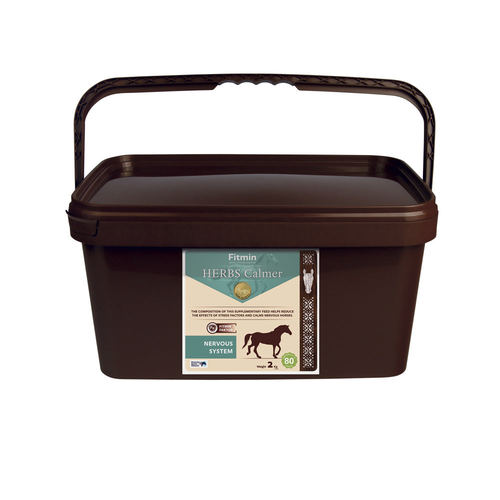 A 2kg brown bucket of Fitmin Herbs Calmer, a herbal supplementary feed for the horse's nervous system. The label features a muted teal and cream design with a horse silhouette, stating it helps reduce the effects of stress factors and calms nervous horses. It includes the Fitmin Faktor and provides approximately 80 doses.