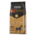 Packaging for Fitmin Horse Muesli Meadow, featuring a tan and dark grey design. The label highlights a balanced composition with natural fibre for digestive tract activity and DHA for brain function, presented as a high-quality muesli with essential minerals and the Fitmin Faktor.