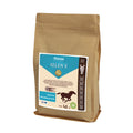 A 1.5kg paper bag of Fitmin Selen E supplementary food for horses. The label features a bright blue and cream design with a galloping horse silhouette, highlighting "Muscle Regeneration." It specifies an antioxidant effect to prevent painful tying-up and speed up recovery during high-intensity training, containing up to 30 doses.