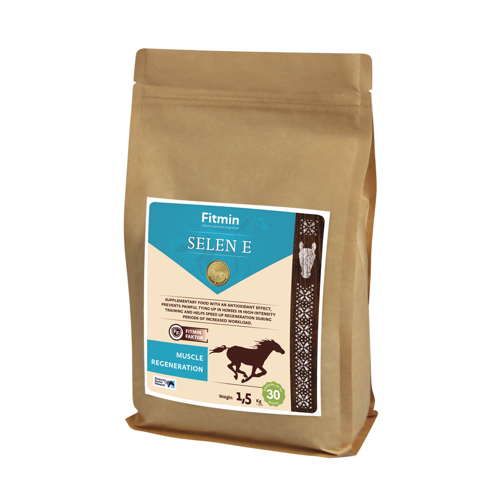 A 1.5kg paper bag of Fitmin Selen E supplementary food for horses. The label features a bright blue and cream design with a galloping horse silhouette, highlighting "Muscle Regeneration." It specifies an antioxidant effect to prevent painful tying-up and speed up recovery during high-intensity training, containing up to 30 doses.