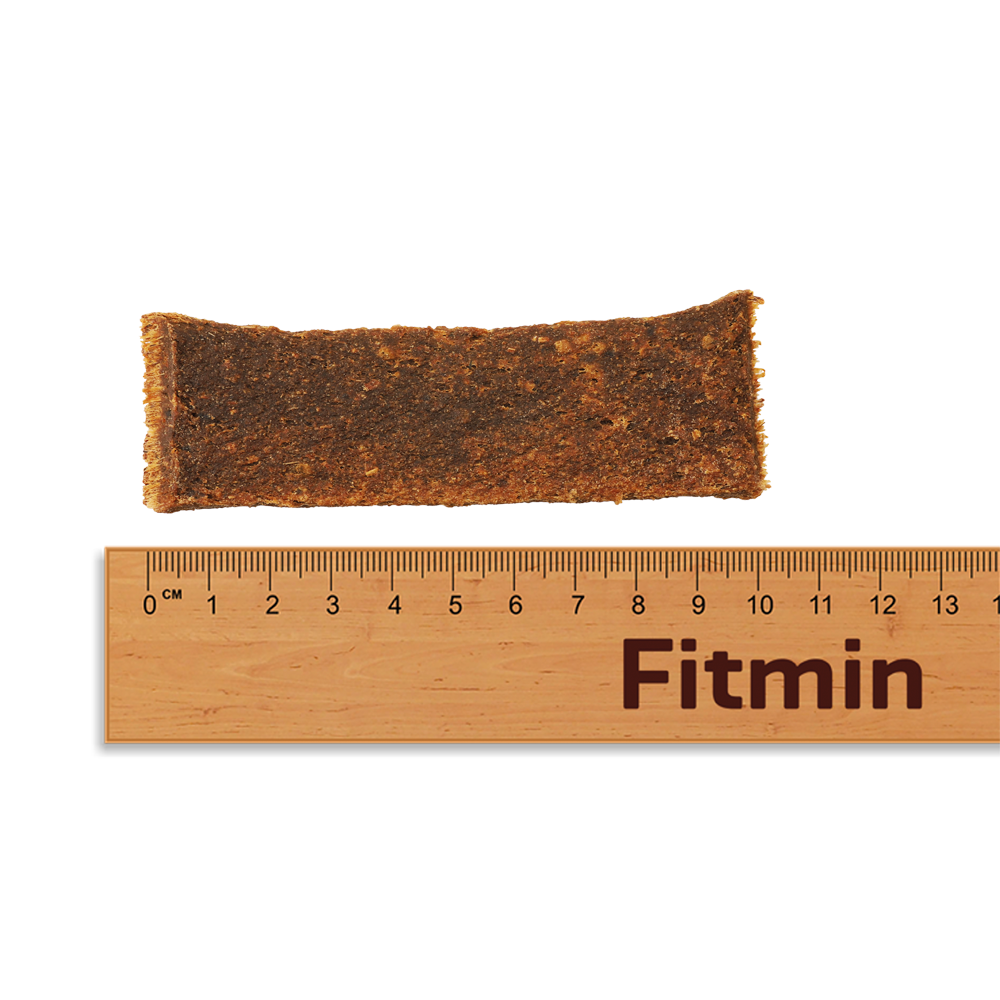 Close-up of a breakable Fitmin Chicken Stripe showing the natural grain and herbal inclusions.